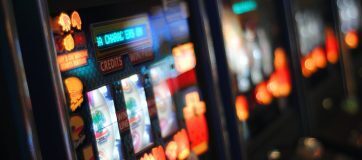 a sequence of softly blurred pokie machines