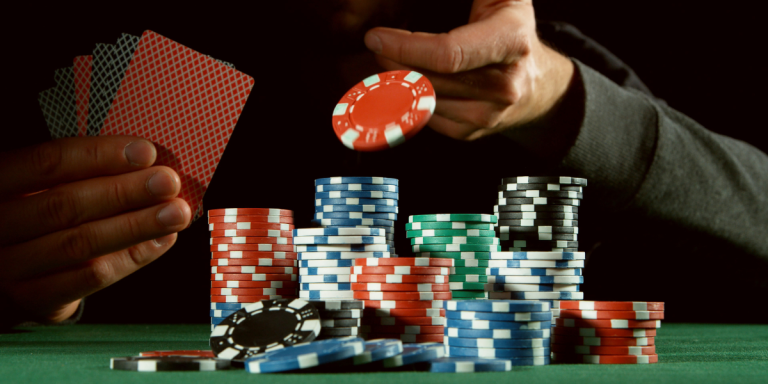 A snapshot of a player placing a bet during an intense poker game.
